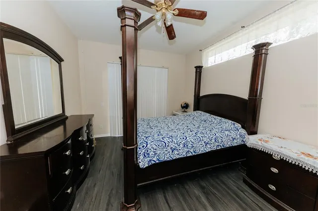 a bedroom with a bed and a dresser