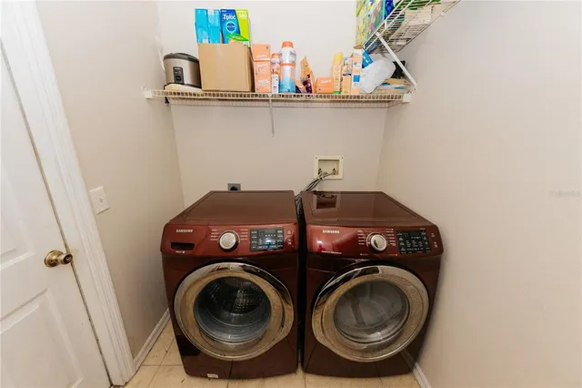 a utility room with dryer and washer