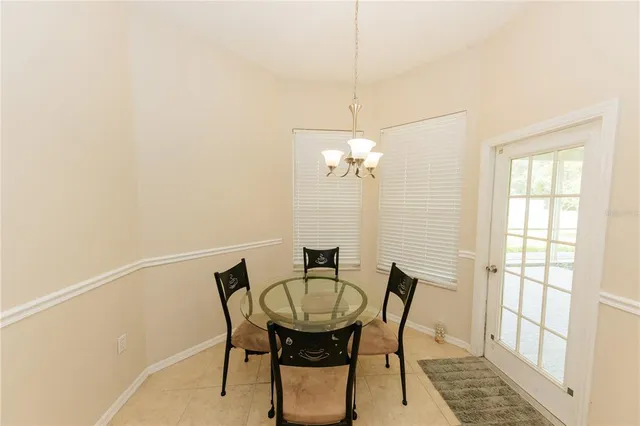 a view of a dining room with furniture and a window