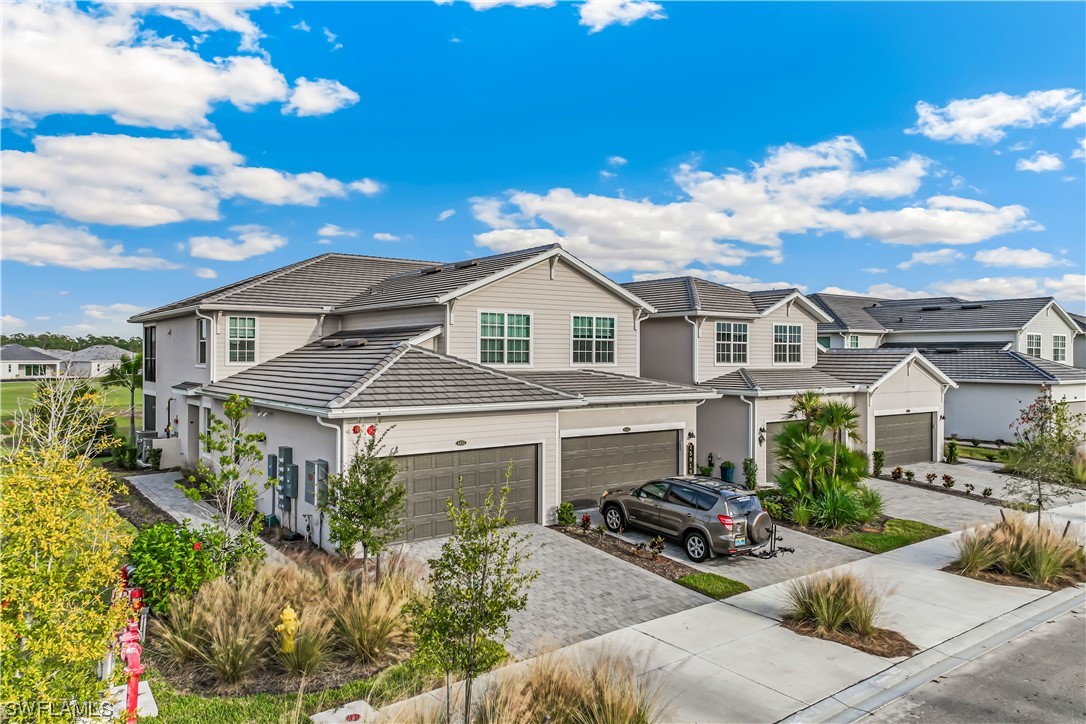 15919 Grassland Lane, Unit 4211 Punta Gorda, FL 33982 - Photo 1 of 40 a front view of a house with garden