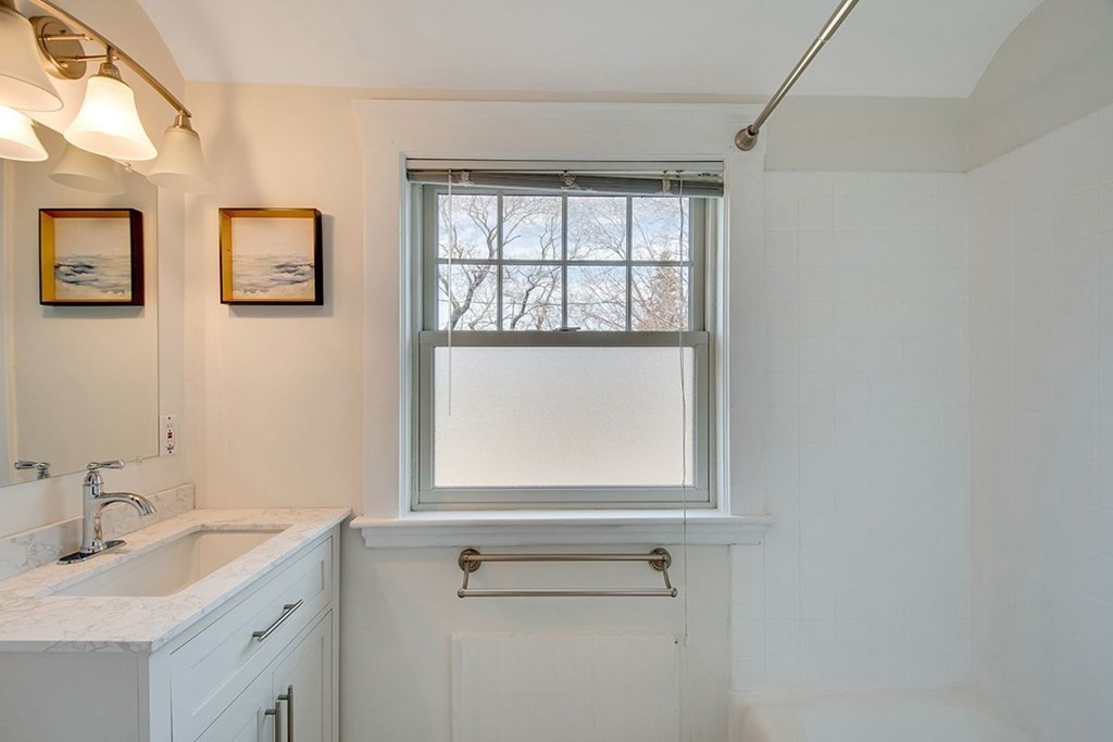 11 Angier Circle Newton, MA 02466 - Photo 14 of 21 a bathroom with a sink window and mirror