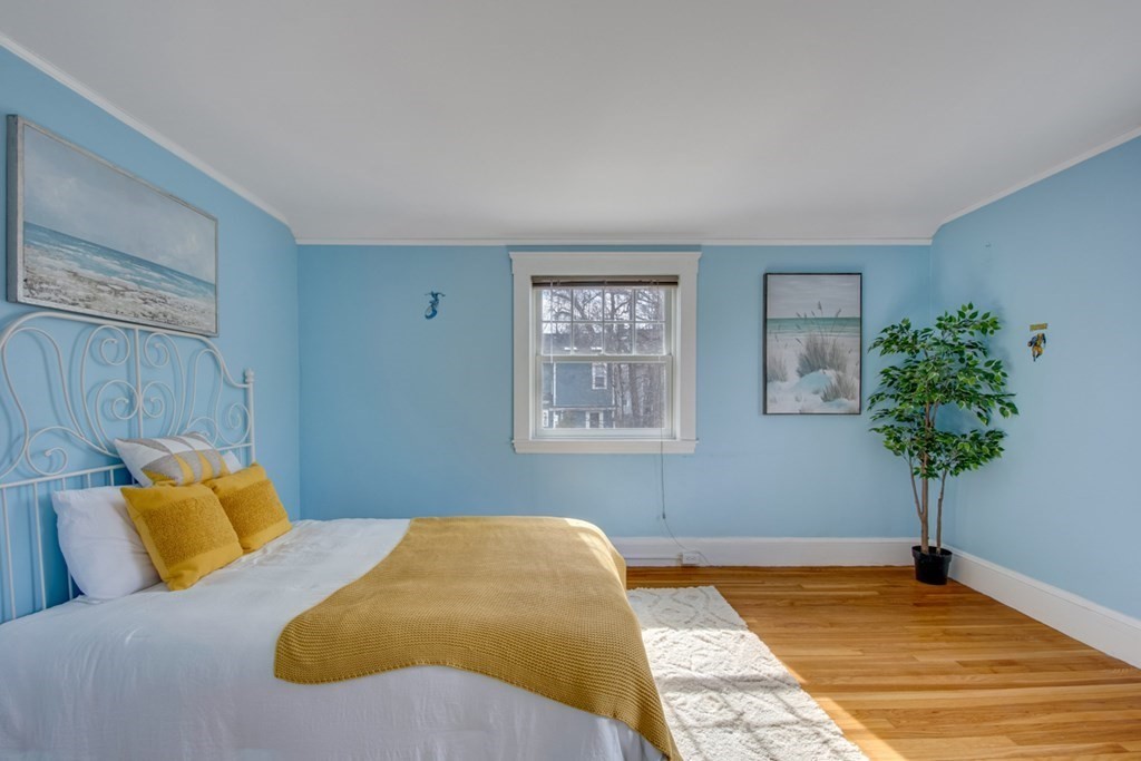11 Angier Circle Newton, MA 02466 - Photo 16 of 21 a bedroom with a bed and a potted plant