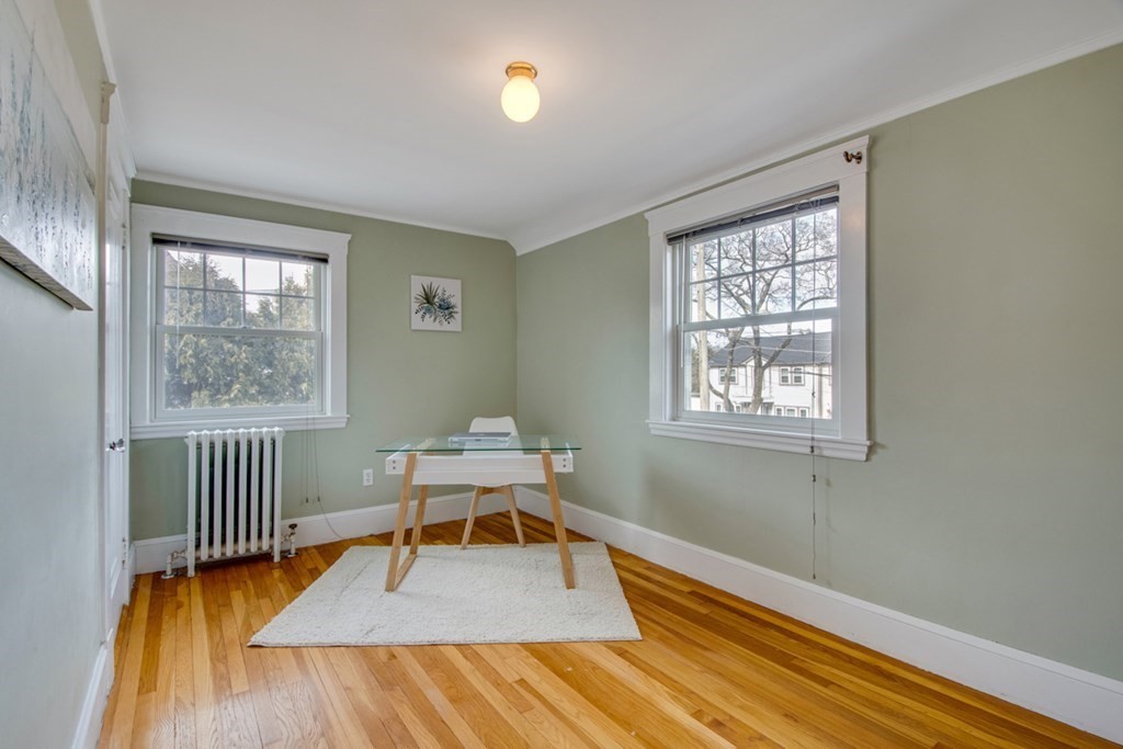 11 Angier Circle Newton, MA 02466 - Photo 17 of 21 a reading room with wooden floor and windows