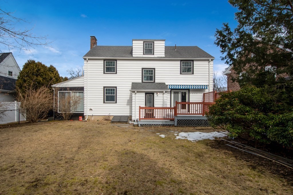 11 Angier Circle Newton, MA 02466 - Photo 18 of 21 a front view of a house with a garden