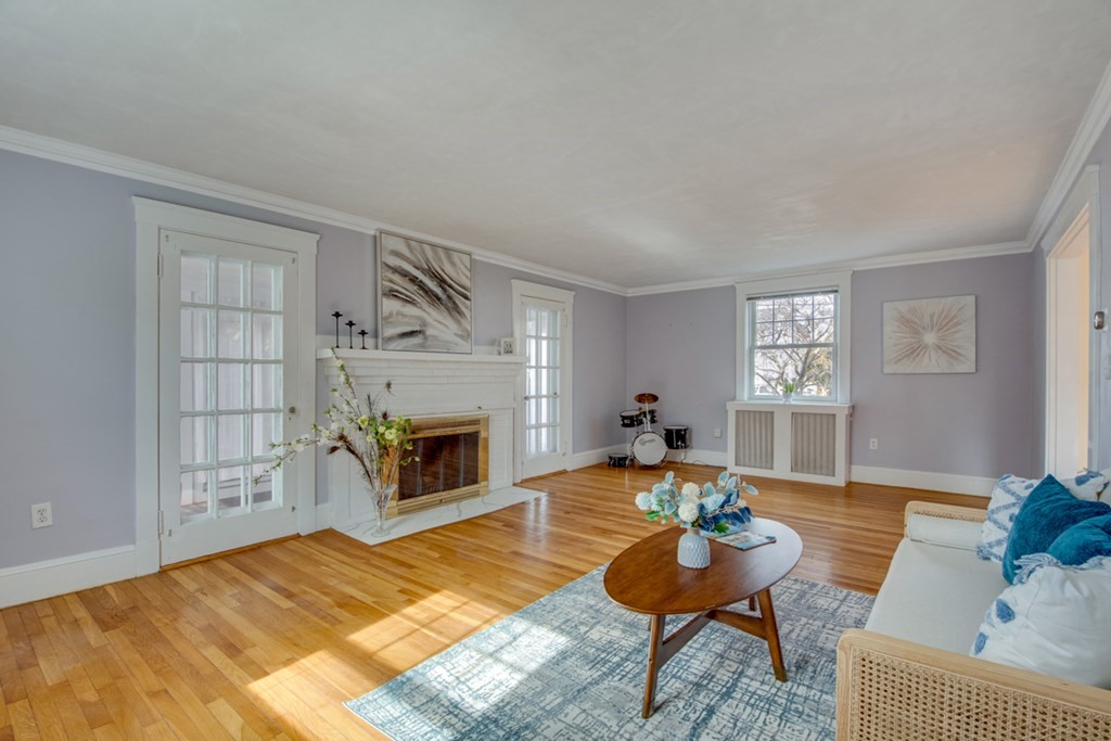 11 Angier Circle Newton, MA 02466 - Photo 6 of 21 a living room with furniture and a fireplace