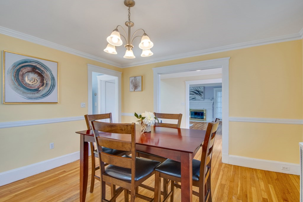 11 Angier Circle Newton, MA 02466 - Photo 8 of 21 a view of a dining room with furniture and wooden floor