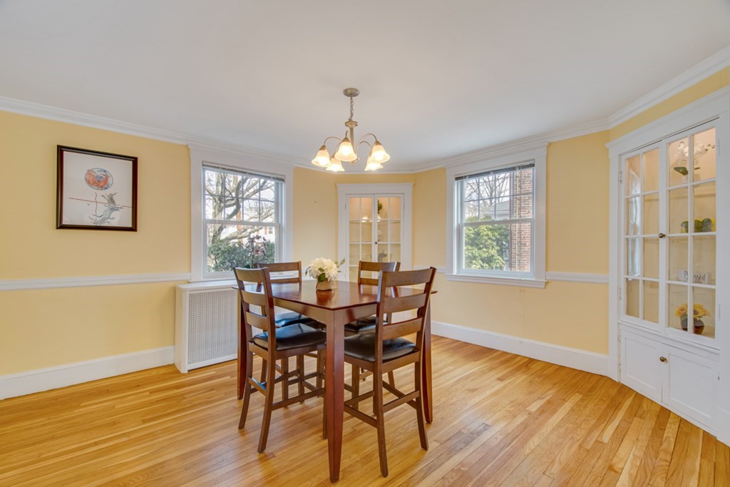 11 Angier Circle Newton, MA 02466 - Photo 9 of 21 a view of a dining room with furniture and wooden floor