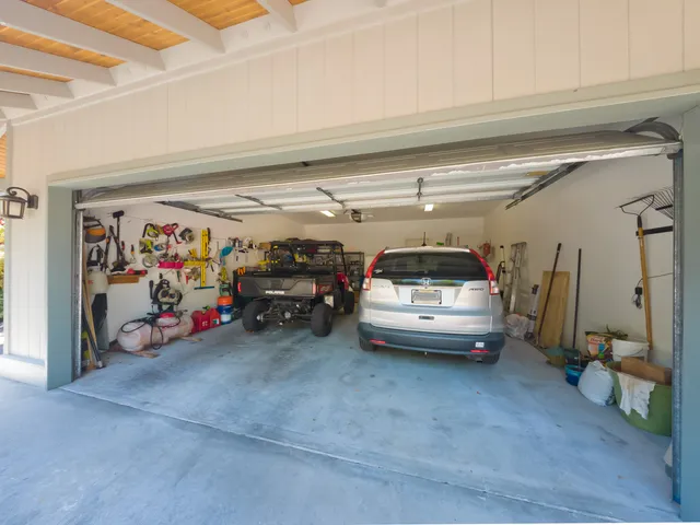 a view of parking garage with cars
