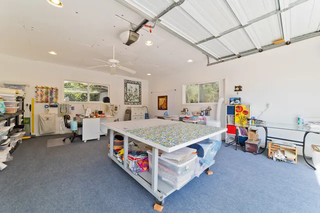 a spacious bedroom with a bed a couch and a walk in closet