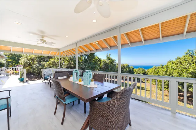 a view of a patio with a table and chairs