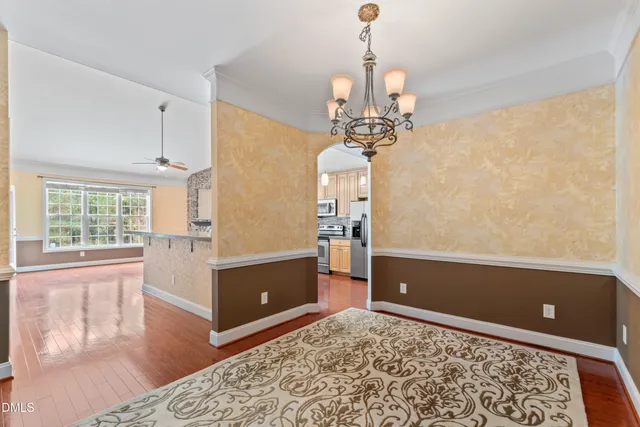 a view of a livingroom with furniture window and wooden floor