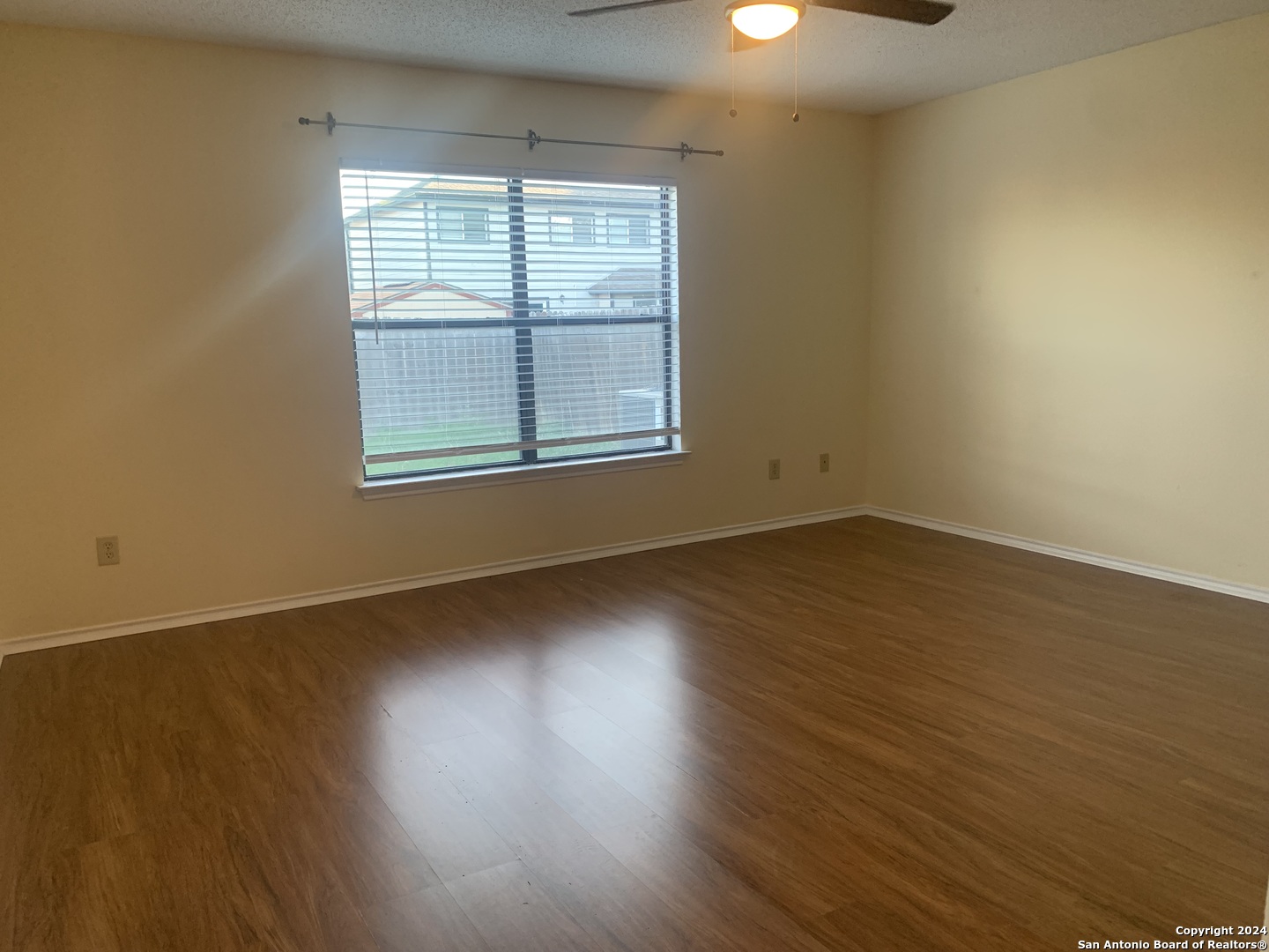 8311 Tavern Point San Antonio, TX 78254 - Photo 13 of 21 an empty room with wooden floor and windows