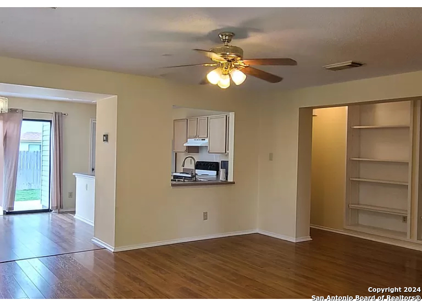 8311 Tavern Point San Antonio, TX 78254 - Photo 5 of 21 wooden floor in an empty room with a window