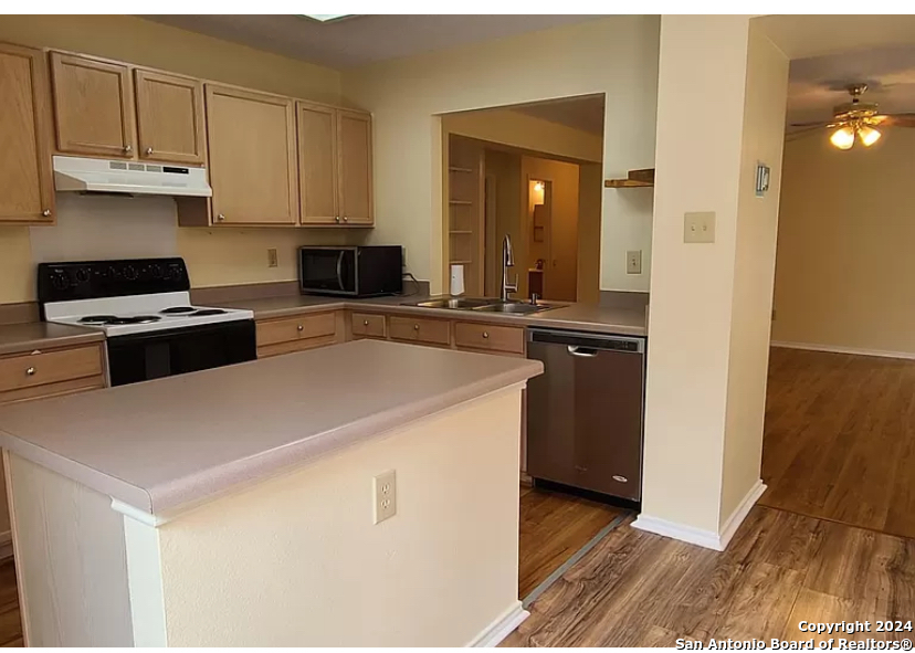 8311 Tavern Point San Antonio, TX 78254 - Photo 7 of 21 a kitchen with a sink and a stove top oven