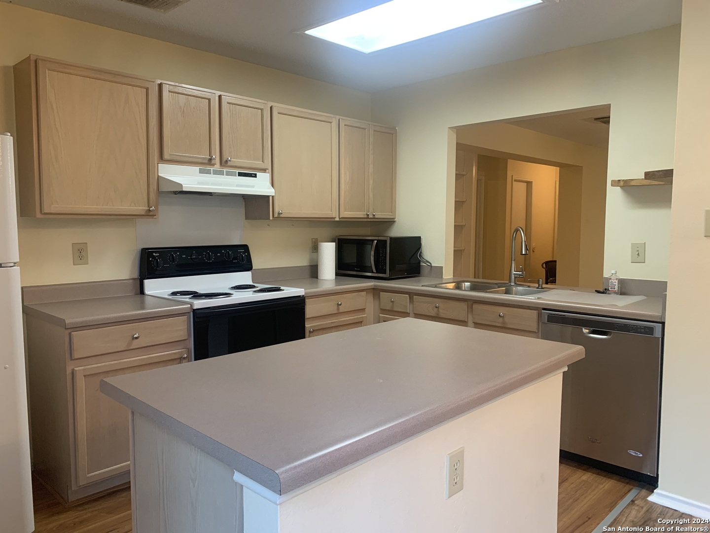 8311 Tavern Point San Antonio, TX 78254 - Photo 9 of 21 a kitchen with stainless steel appliances granite countertop a sink a stove and a refrigerator