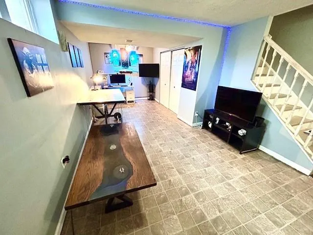 a living room with furniture and a flat screen tv