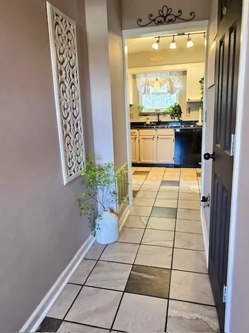 a lobby with furniture and a large window