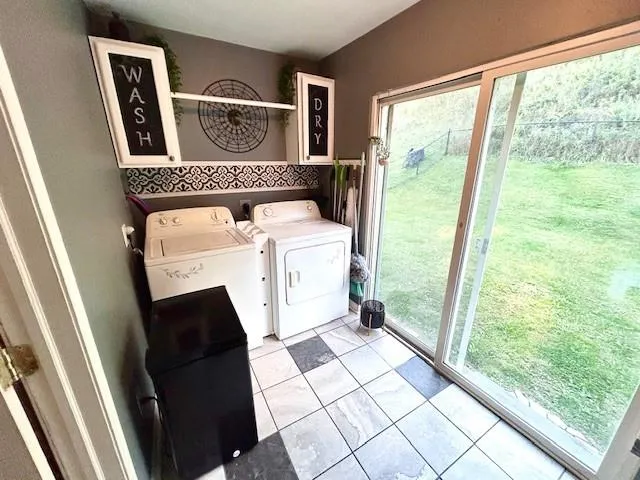a utility room with a window dryer and washer