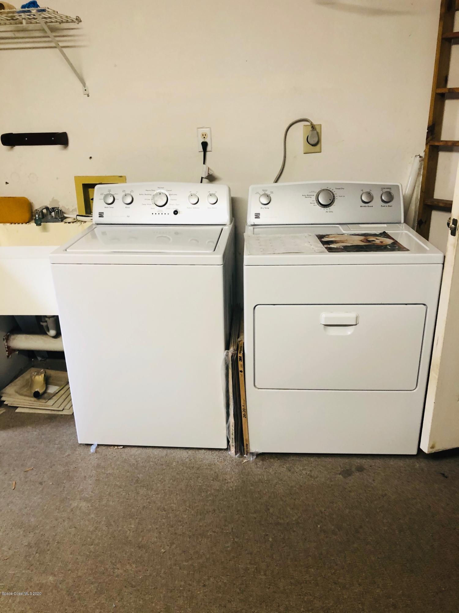 1256 Winding Meadows Road Rockledge, FL 32955 - Photo 15 of 16 a utility room with dryer and washer