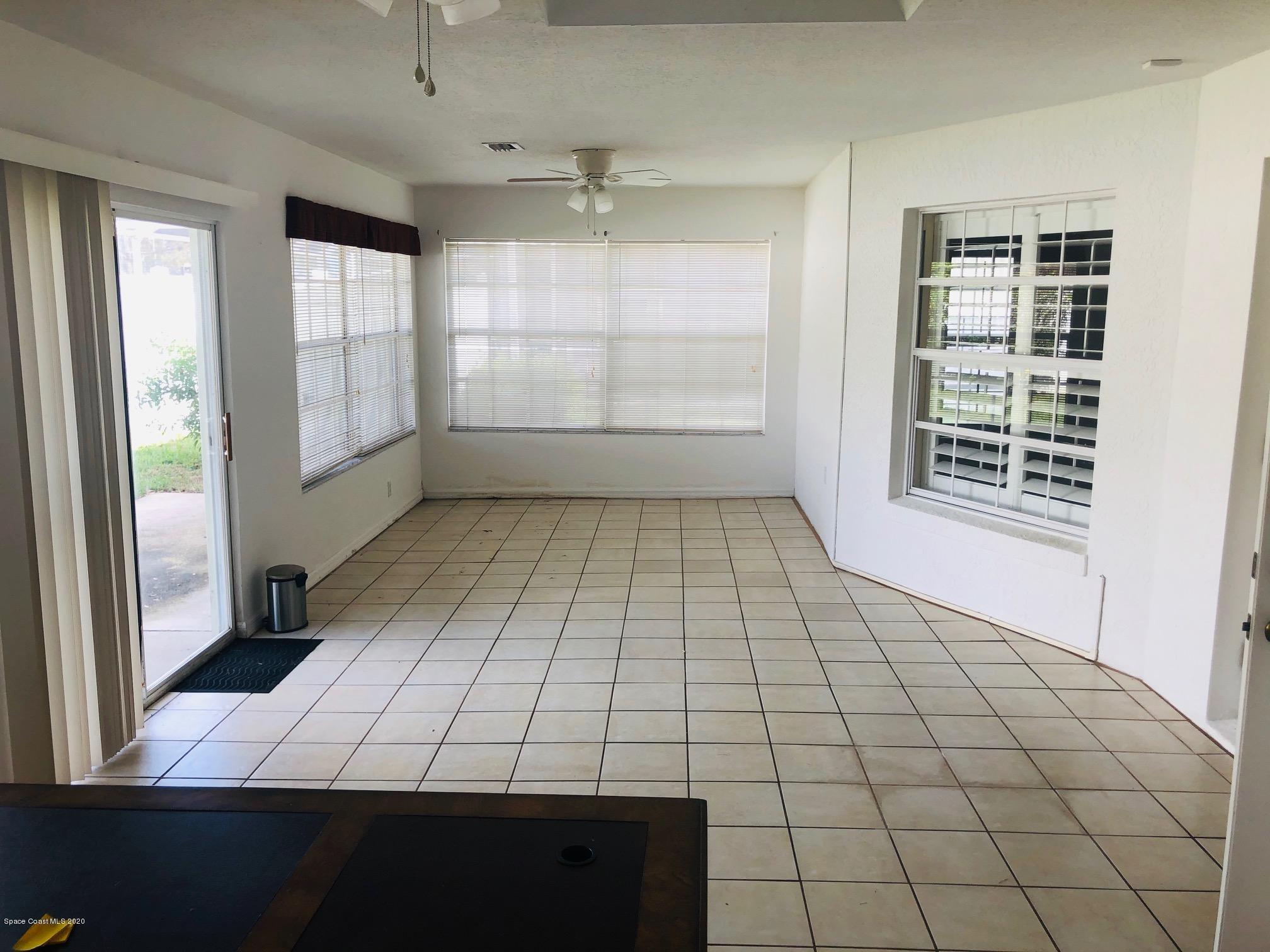1256 Winding Meadows Road Rockledge, FL 32955 - Photo 9 of 16 a view of an empty room and window