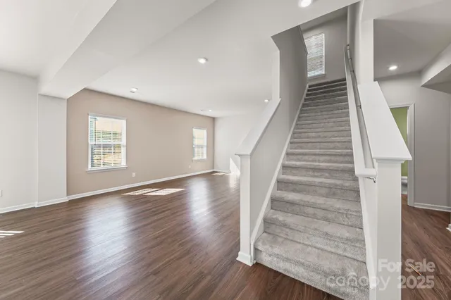 a view of an entryway with wooden floor