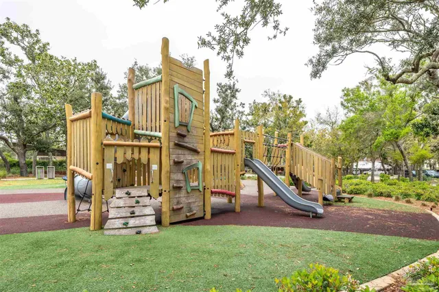 a view of a pathway with a bench in front of it