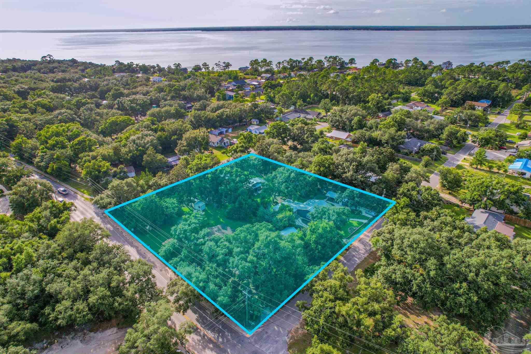 5661 Galvez Road Pensacola, FL 32507 - Photo 28 of 60 a view of a yard with potted plants