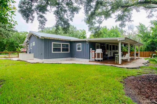 a kitchen with stainless steel appliances granite countertop a refrigerator a sink and a stove