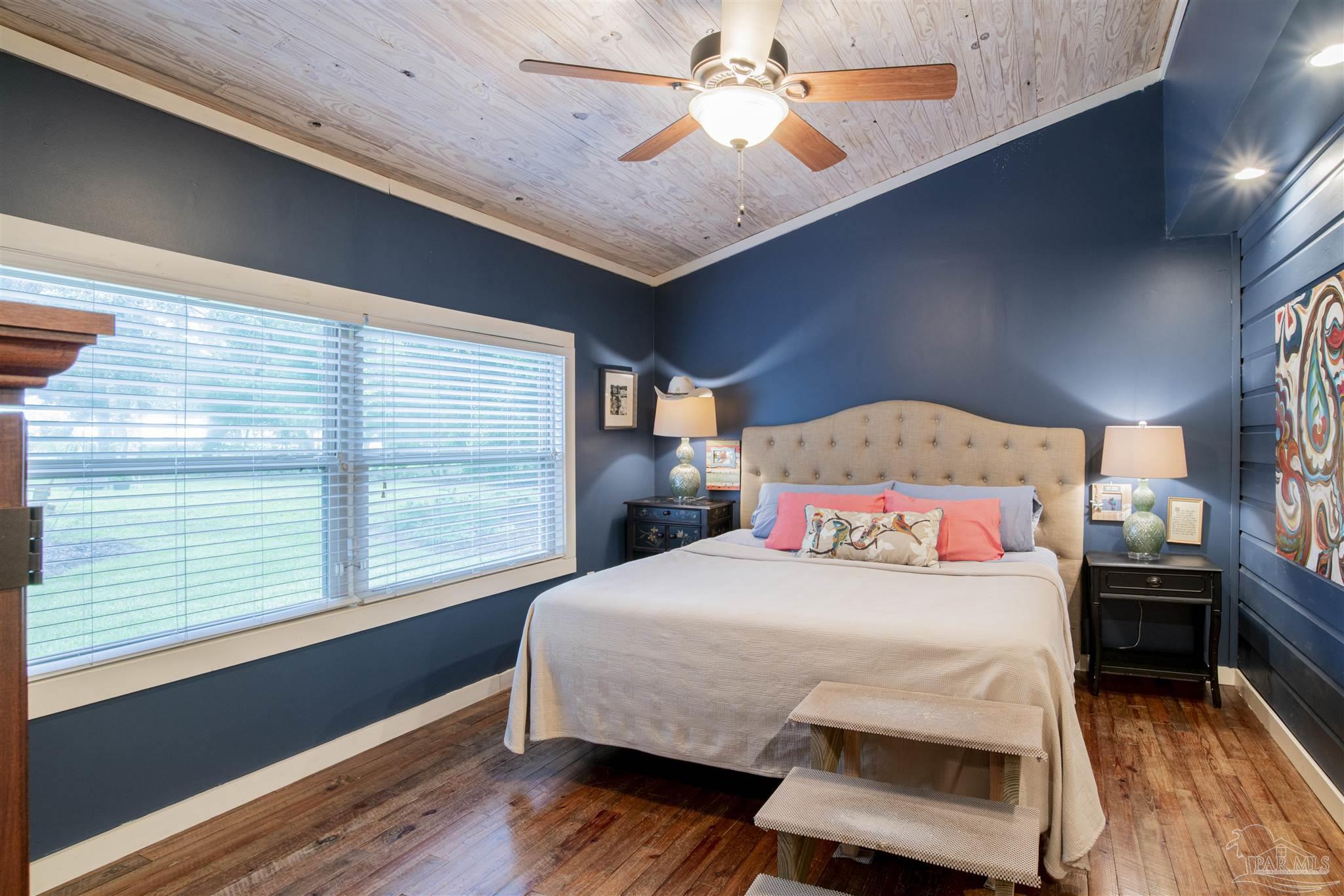 5661 Galvez Road Pensacola, FL 32507 - Photo 51 of 60 a bedroom with a bed and a window