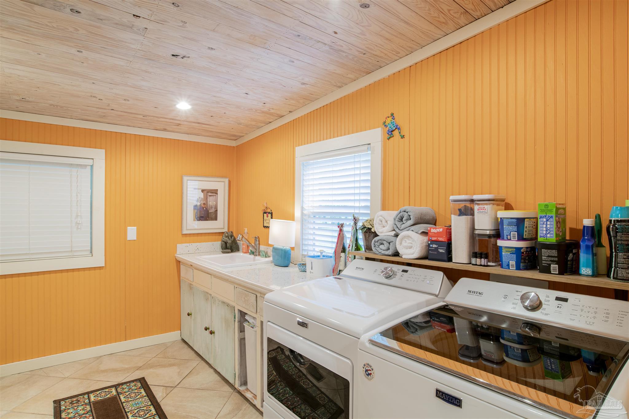 5661 Galvez Road Pensacola, FL 32507 - Photo 55 of 60 a kitchen with stainless steel appliances a stove a sink and a refrigerator