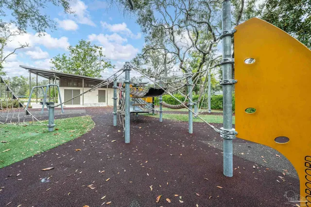 a patio with a table and chairs with the view of lake