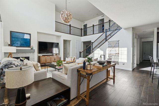 a living room with fireplace furniture and a flat screen tv