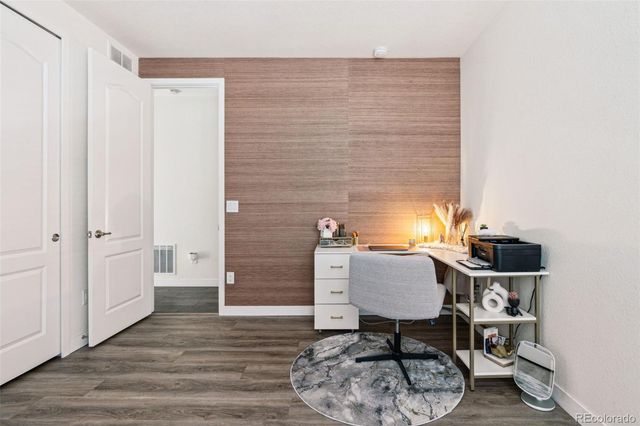 a view of workspace with wooden floor