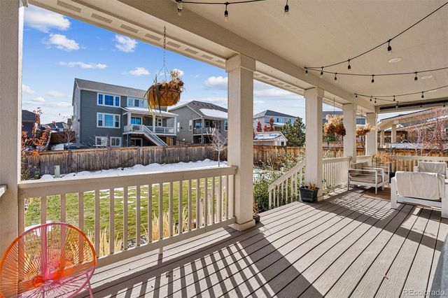 a front view of a house with outdoor seating
