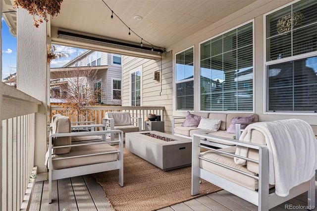 a bedroom with furniture and a large window
