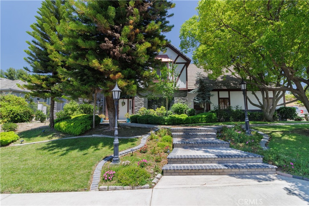 1477 Hampton Road Redlands, CA 92374 - Photo 1 of 1 a front view of a house with a yard