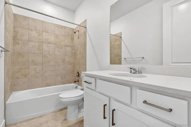 a bathroom with a sink a toilet and a bathtub