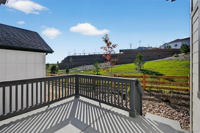 a view of a balcony with wooden floor