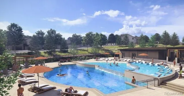 a view of a swimming pool with a yard