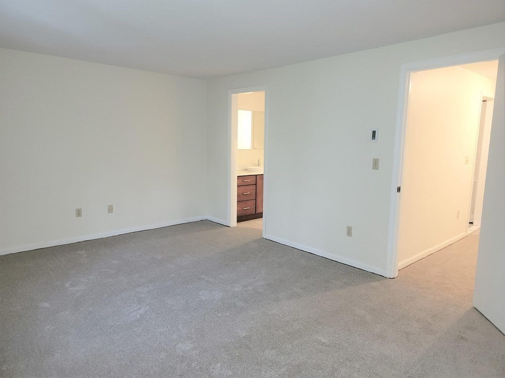 174 Lowell Road, Unit 24 Mashpee, MA 02649 - Photo 11 of 16 a view of an empty room with a window