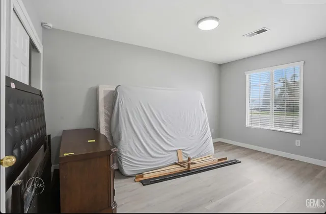 a view of a room with gym equipment and a large window
