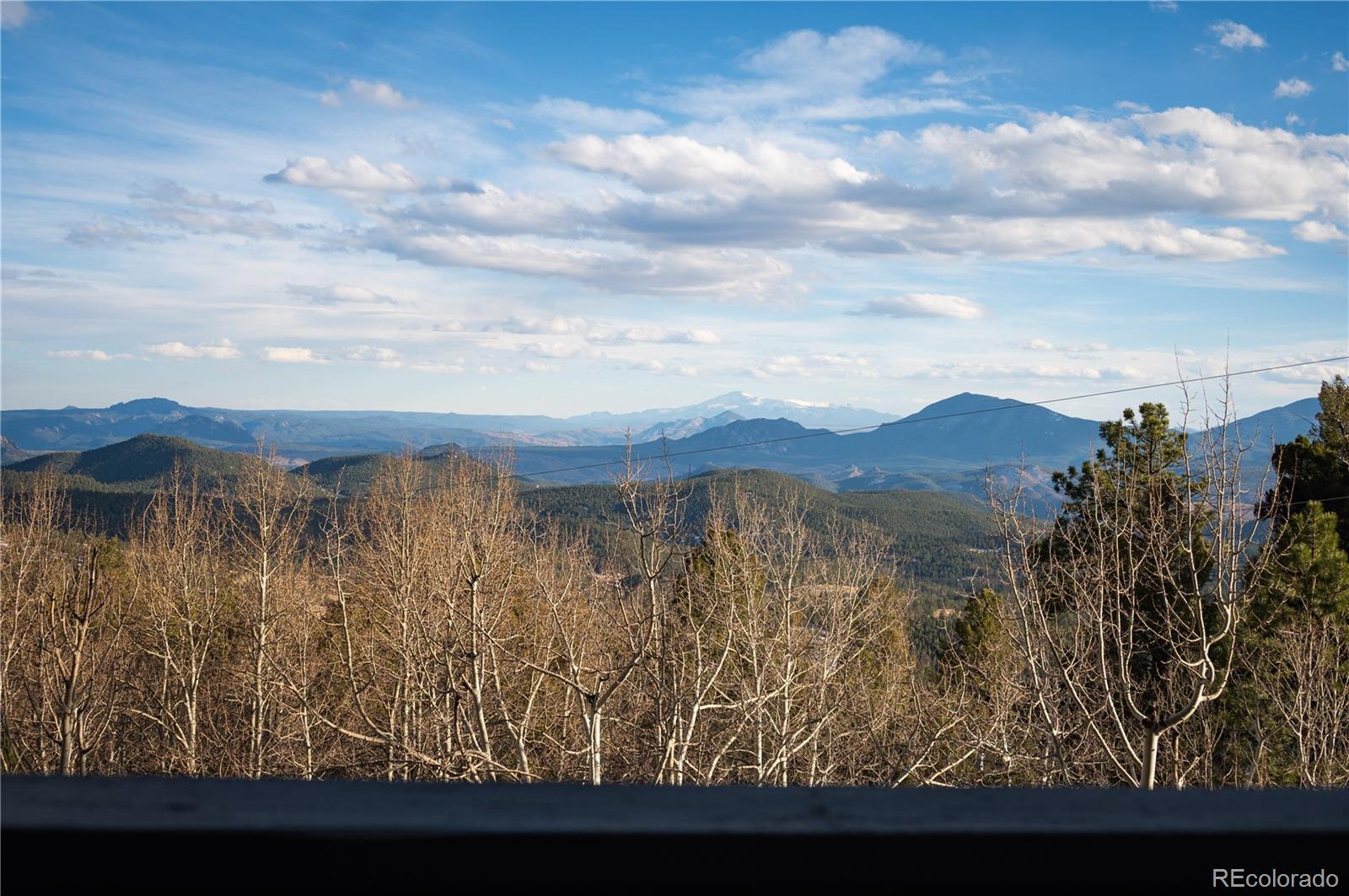 11740 Baca Road Conifer, CO 80433 - Photo 7 of 49 a view of lake with mountain