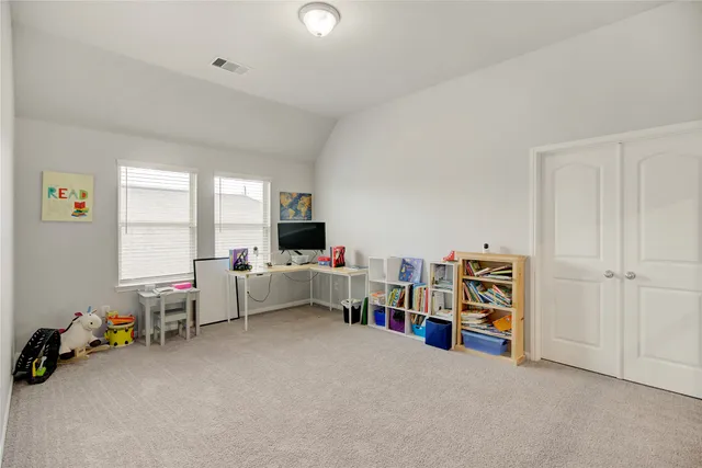a bathroom with a granite countertop sink a bathtub a mirror and vanity