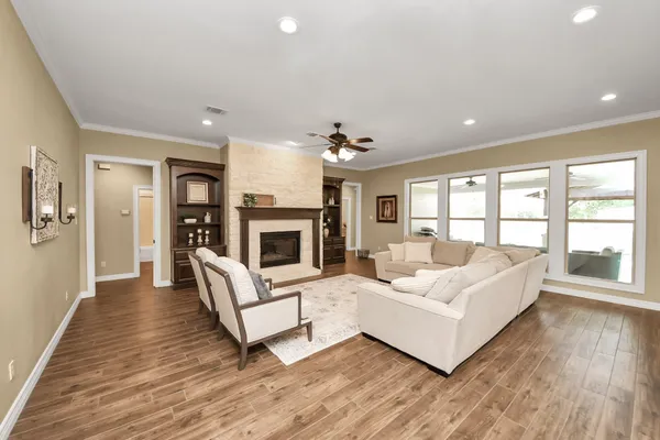 a large kitchen with kitchen island a sink appliances and cabinets