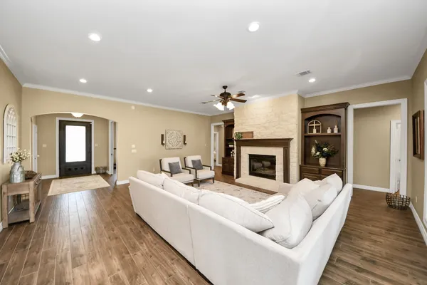 a view of a dining room with furniture wooden floor and chandelier