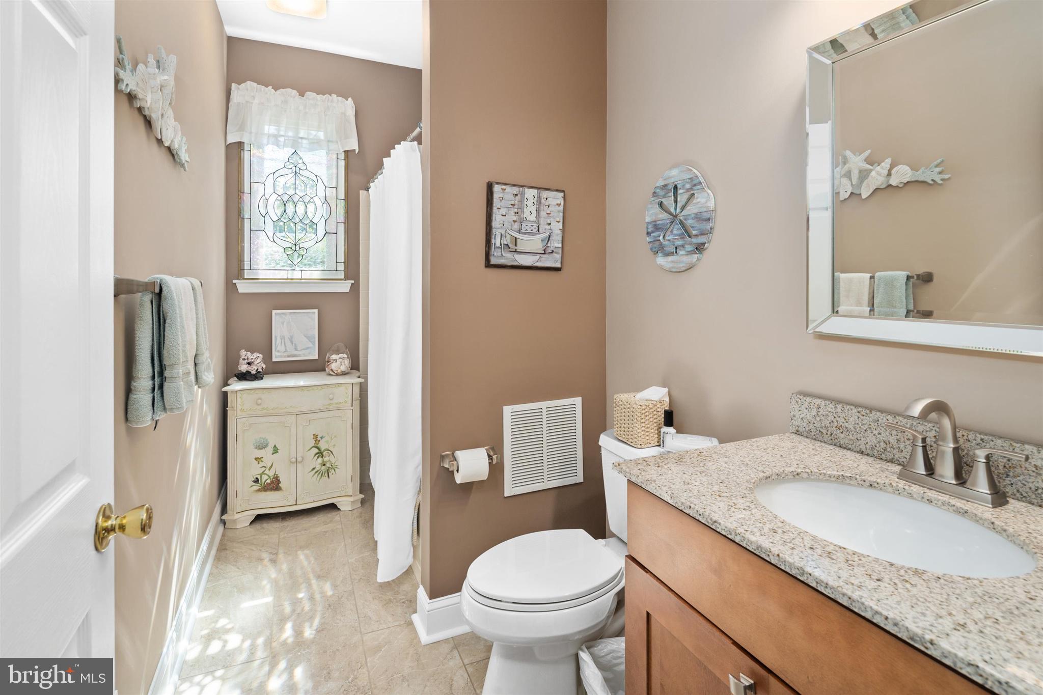16 Winterberry Terrace Hamilton, NJ 08690 - Photo 13 of 26 a bathroom with a granite countertop sink toilet and shower