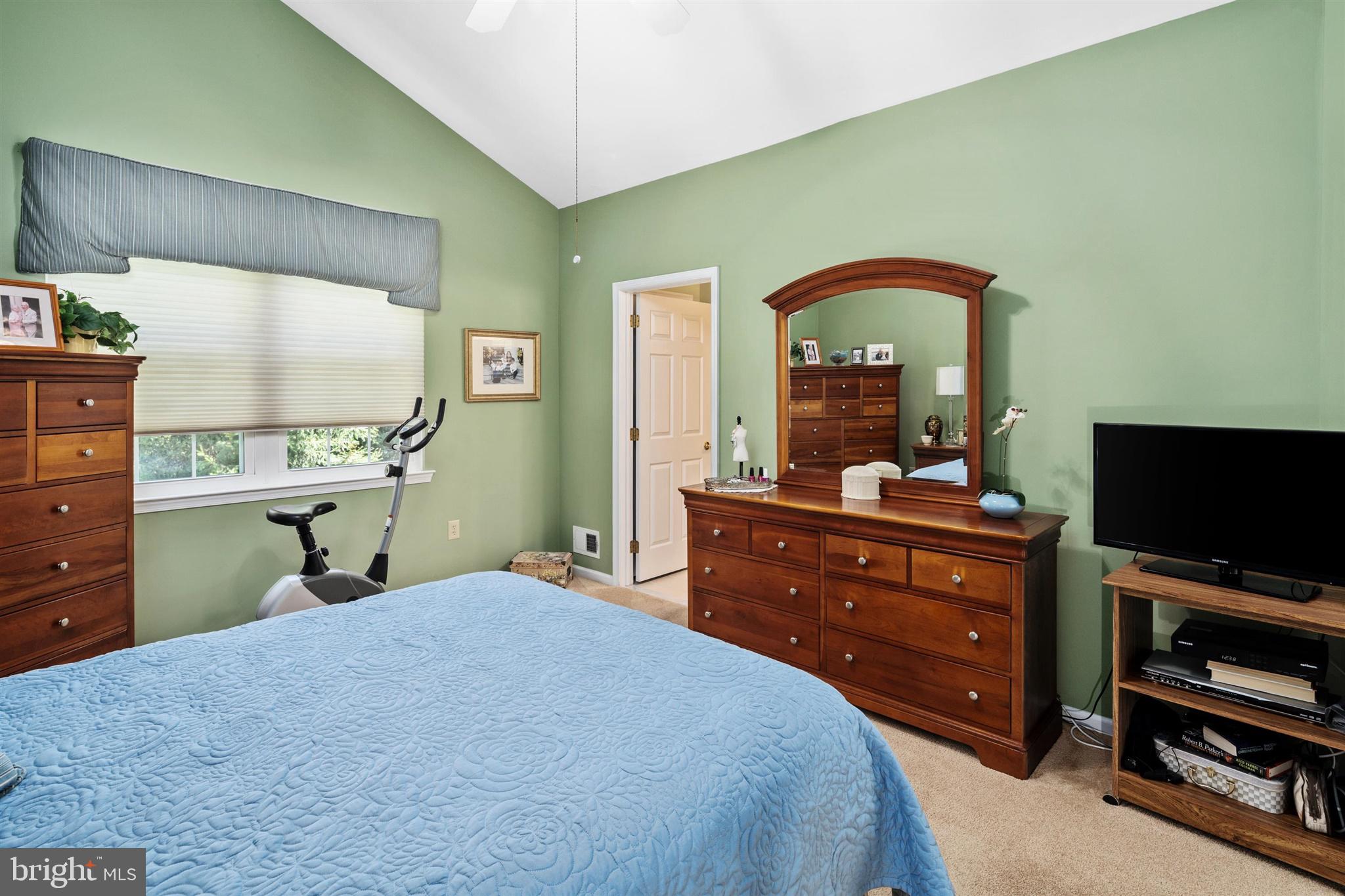 16 Winterberry Terrace Hamilton, NJ 08690 - Photo 17 of 26 a bedroom with a bed and a flat tv screen on dresser