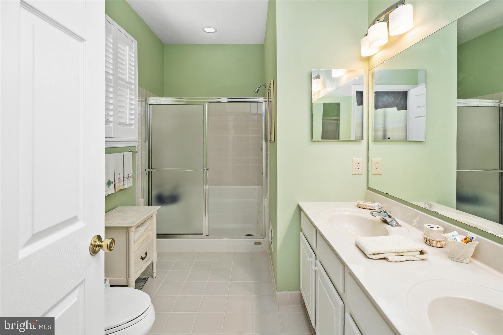 16 Winterberry Terrace Hamilton, NJ 08690 - Photo 18 of 26 a bathroom with a sink a toilet and shower