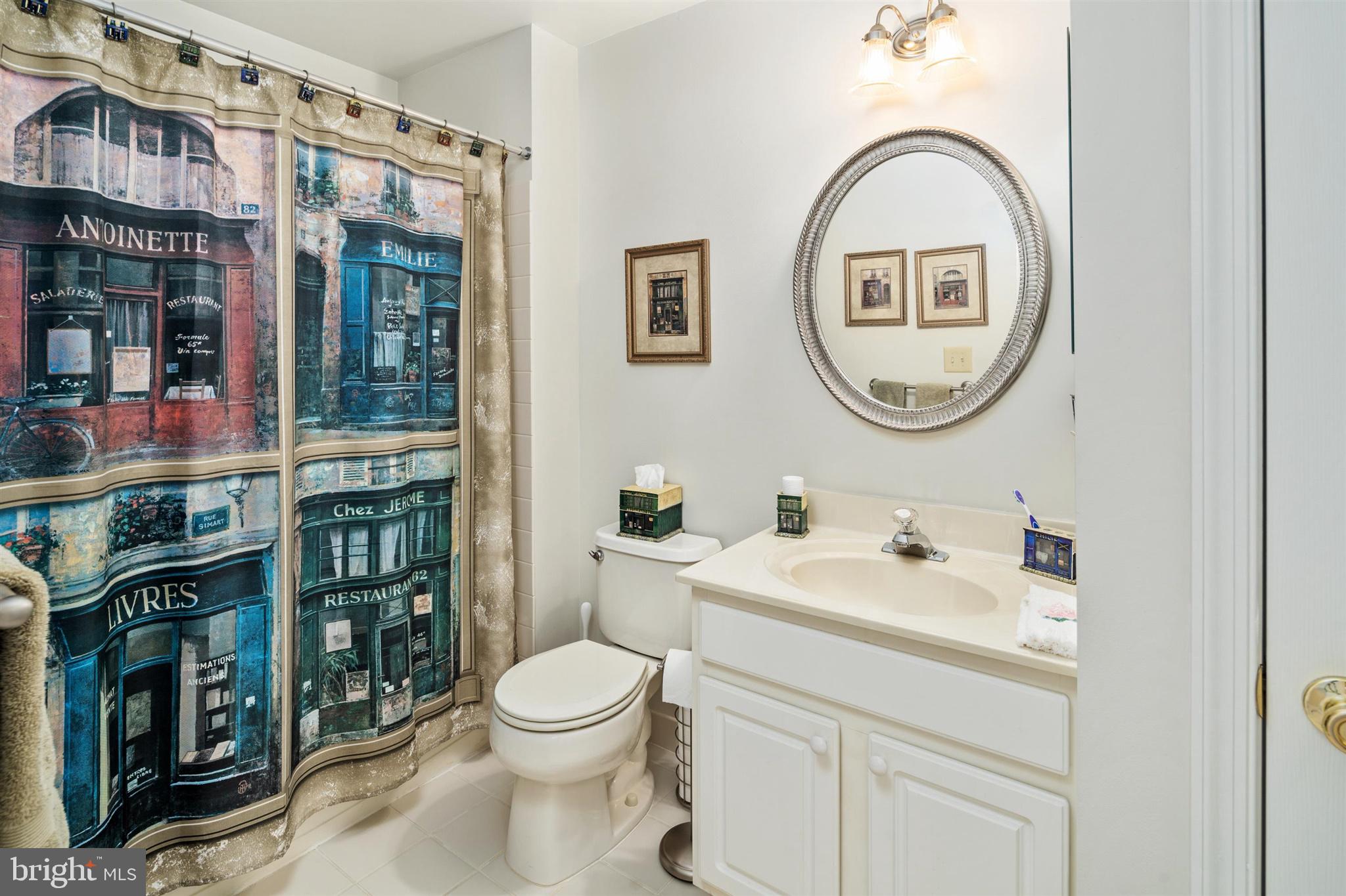 16 Winterberry Terrace Hamilton, NJ 08690 - Photo 20 of 26 a bathroom with a toilet a sink and a mirror