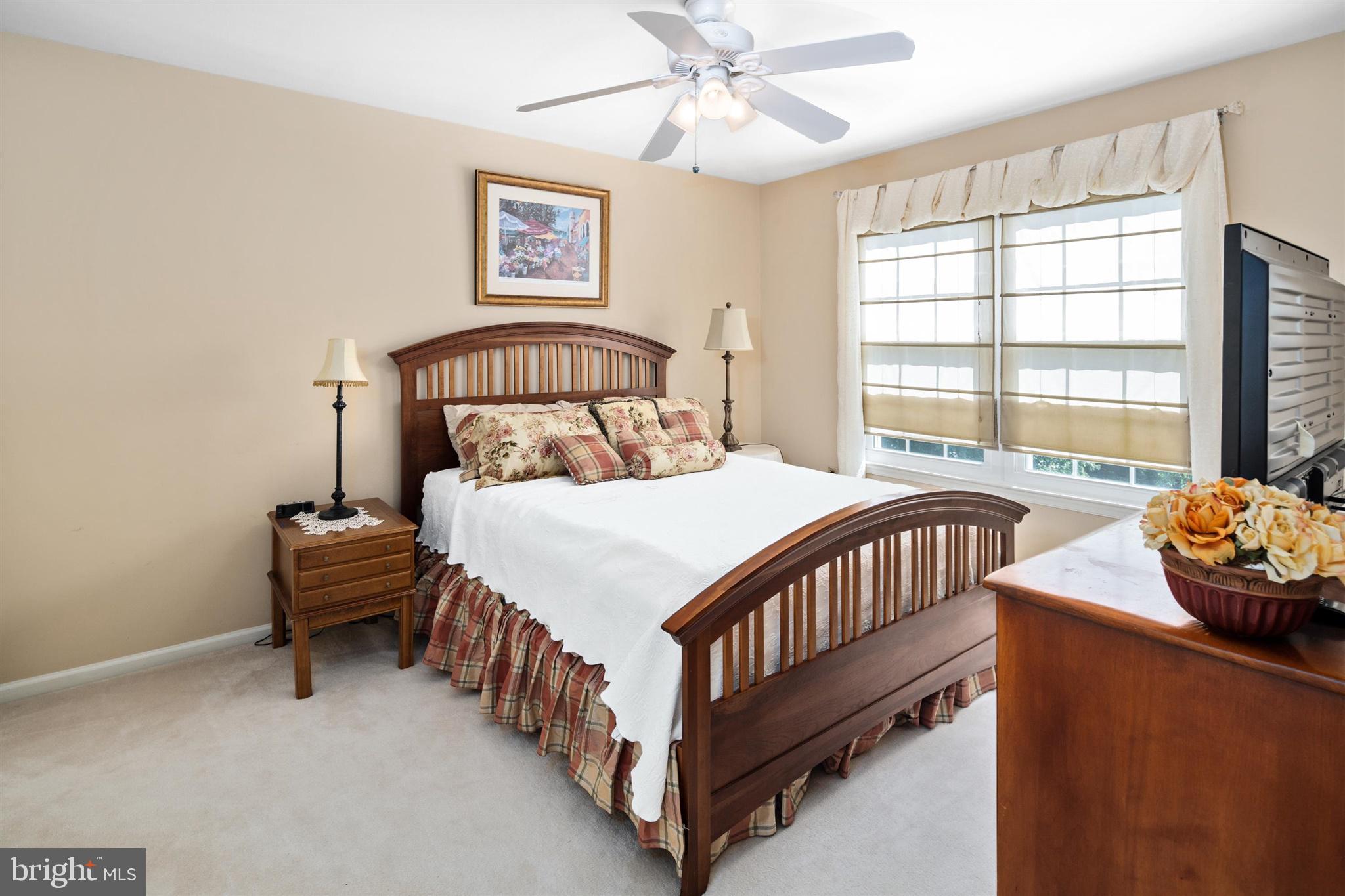 16 Winterberry Terrace Hamilton, NJ 08690 - Photo 21 of 26 a bedroom with a bed and a large window